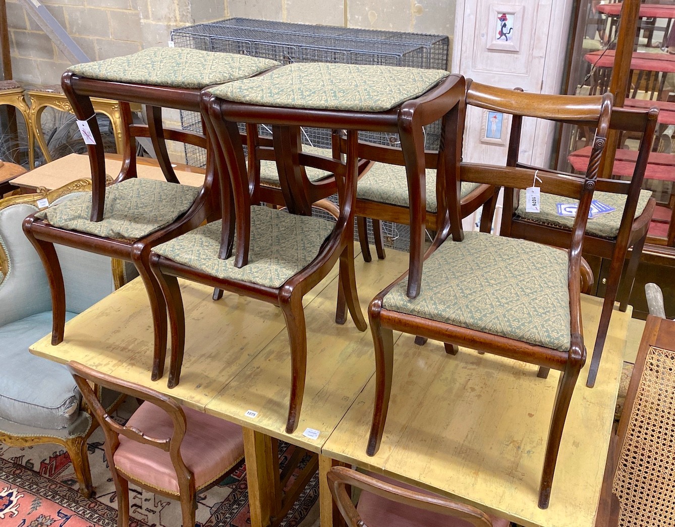 Six Regency mahogany cane and drop in seat dining chairs (four plus two) together with a pair of similar stools